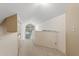 Bright upper hallway featuring neutral carpeting, a window, and lots of natural light at 3987 Lancashire Ln # 3987, Longwood, FL 32779