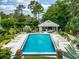Relax at the community pool with ample lounge chairs and a covered cabana, perfect for leisure and relaxation at 3987 Lancashire Ln # 3987, Longwood, FL 32779