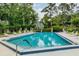A refreshing community pool is surrounded by lush landscaping and provides a serene spot for residents at 3987 Lancashire Ln # 3987, Longwood, FL 32779