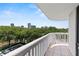 Enjoy stunning skyline views from the balcony, with trees, and blue skies at 400 E Colonial Dr # 402, Orlando, FL 32803