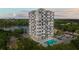 Stunning high-rise condo building with a pool and balconies overlooking the city and lake at 400 E Colonial Dr # 402, Orlando, FL 32803