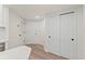Hallway with modern sliding closet doors and light wood floors at 400 E Colonial Dr # 402, Orlando, FL 32803