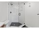 Bathroom with glass enclosed shower with black accents and a tiled shower wall at 400 E Colonial Dr # 402, Orlando, FL 32803
