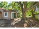 Large back yard with a sliding glass door and mature tree creating shade at 470 Oak Haven Dr # 470, Altamonte Springs, FL 32701