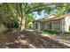 Expansive back yard featuring lush landscaping, mature tree, and home exterior at 470 Oak Haven Dr # 470, Altamonte Springs, FL 32701