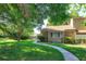 Charming brick home featuring a well-maintained lawn and a curved walkway to the entrance at 470 Oak Haven Dr # 470, Altamonte Springs, FL 32701