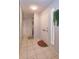 Hallway with stacked washer and dryer, tile flooring, and a modern aesthetic at 470 Oak Haven Dr # 470, Altamonte Springs, FL 32701