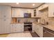 Charming kitchen with stainless steel appliances, granite countertops, and white cabinets at 470 Oak Haven Dr # 470, Altamonte Springs, FL 32701