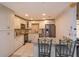 Updated kitchen featuring granite counters, stainless steel appliances, and a cozy breakfast bar at 470 Oak Haven Dr # 470, Altamonte Springs, FL 32701