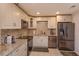 Well-lit kitchen featuring granite counters, stainless steel appliances, and updated cabinetry at 470 Oak Haven Dr # 470, Altamonte Springs, FL 32701