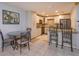 Well-lit kitchen with white cabinets, granite countertops, and adjacent dining area, perfect for gatherings at 470 Oak Haven Dr # 470, Altamonte Springs, FL 32701
