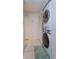 Efficient laundry area with stacked washer and dryer units and tiled flooring at 470 Oak Haven Dr # 470, Altamonte Springs, FL 32701