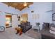 Living room with vaulted ceiling, comfortable seating, and a barn door leading to bedroom at 470 Oak Haven Dr # 470, Altamonte Springs, FL 32701
