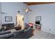 Living room featuring vaulted ceiling, neutral furniture, tile flooring, and open access to other rooms at 470 Oak Haven Dr # 470, Altamonte Springs, FL 32701