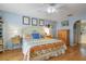 Serene bedroom with hardwood floors, ample light, and a classic ceiling fan at 4927 Fiske Cir, Orlando, FL 32826