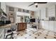 Spacious home office with tiled floors, built-in shelves and cabinets, and multiple workspaces at 4927 Fiske Cir, Orlando, FL 32826