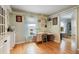 Home office with wood floors, desk, chair, and shelving; natural light from a window at 4927 Fiske Cir, Orlando, FL 32826