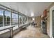 Enclosed patio area with tile flooring, string lights, and a view of the pool and backyard at 4927 Fiske Cir, Orlando, FL 32826