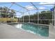 Large, enclosed pool area, offering a private and relaxing outdoor space with a view of the fenced backyard at 4927 Fiske Cir, Orlando, FL 32826