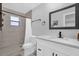 Modern bathroom boasts a new vanity, framed mirror, tiled walls and shower over the tub at 508 Boxelder Ave, Altamonte Springs, FL 32714