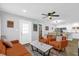 Open-concept living room with contemporary decor and seamless flow to the kitchen at 508 Boxelder Ave, Altamonte Springs, FL 32714