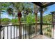 Scenic balcony view with trees overlooking a lake at 6107 Metrowest Blvd # 104, Orlando, FL 32835