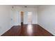 Spacious bedroom featuring wood floors and access to closet and bathroom at 6107 Metrowest Blvd # 104, Orlando, FL 32835