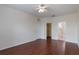 Bedroom boasting wood flooring, ample closet space, and an en-suite bathroom at 6107 Metrowest Blvd # 104, Orlando, FL 32835