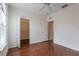Bedroom with a ceiling fan, hard floors, a window and a walk-in closet at 6107 Metrowest Blvd # 104, Orlando, FL 32835