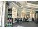 Exercise equipment in a community gym area with natural light from large windows at 6107 Metrowest Blvd # 104, Orlando, FL 32835