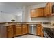 View of kitchen featuring tile floors, stainless steel appliances and attractive cabinets at 6107 Metrowest Blvd # 104, Orlando, FL 32835