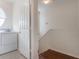 Laundry room with a washer, dryer, and access to a stairwell at 6107 Metrowest Blvd # 104, Orlando, FL 32835