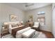 Comfortable main bedroom with lots of light, a ceiling fan, and stylish decor at 6107 Metrowest Blvd # 104, Orlando, FL 32835