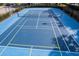 Bright blue tennis court in community featuring clearly painted lines at 6107 Metrowest Blvd # 104, Orlando, FL 32835