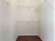 A walk-in closet with wire shelves and hardwood floors at 6107 Metrowest Blvd # 104, Orlando, FL 32835
