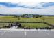 Community dog park with fenced areas, seating, and lush green surroundings at 7032 Rolling Leaf Rd, Groveland, FL 34736