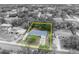 Black and white aerial view displays a lovely single-story home with charming curb appeal at 806 Bear Lake Rd, Apopka, FL 32703