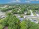 Overhead shot of a house with mature trees in a neighborhood offering a serene environment at 806 Bear Lake Rd, Apopka, FL 32703
