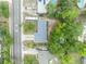 An aerial view showcases a well-maintained home with a new roof, surrounded by lush greenery at 806 Bear Lake Rd, Apopka, FL 32703