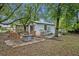 Cozy backyard with comfortable seating around a firepit, ideal for outdoor gatherings at 806 Bear Lake Rd, Apopka, FL 32703