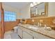 Bright bathroom featuring a granite countertop vanity and walk-in shower at 806 Bear Lake Rd, Apopka, FL 32703