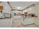 Bright kitchen featuring white cabinetry, granite countertops, and tile flooring for a clean, classic look at 806 Bear Lake Rd, Apopka, FL 32703