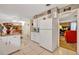 Spacious kitchen featuring white appliances, a tile floor, and easy access to dining and living areas at 806 Bear Lake Rd, Apopka, FL 32703