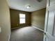 Bedroom featuring carpet flooring, neutral walls, one window for natural light and a walk-in closet at 8417 Leeland Archer Blvd, Orlando, FL 32836