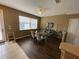 Bright dining area with modern table set, offering ample space for Gathering meals and entertaining guests at 8417 Leeland Archer Blvd, Orlando, FL 32836