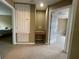 Hallway view featuring carpet flooring, neutral walls and two doorways that lead to separate bedrooms at 8417 Leeland Archer Blvd, Orlando, FL 32836