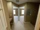 Upstairs hallway view with carpet flooring and two doorways leading into bedrooms and a view of the staircase at 8417 Leeland Archer Blvd, Orlando, FL 32836