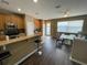Well-lit kitchen with stainless steel appliances, breakfast bar, and seamless flow to the adjacent dining area at 8417 Leeland Archer Blvd, Orlando, FL 32836