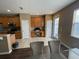 Open-concept kitchen and dining area featuring stylish cabinetry and a functional layout for modern living at 8417 Leeland Archer Blvd, Orlando, FL 32836