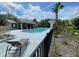 Community pool area with lounge chairs at 8417 Leeland Archer Blvd, Orlando, FL 32836